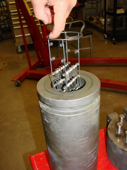 Specimen coupon holder being loaded into ORNL high-pressure autoclave for testing in supercritical carbon dioxide at 750°C/300 bar.