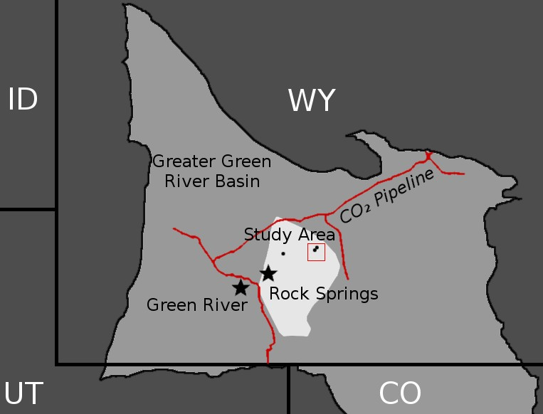 The three well sites (black dots) in the RSU (white area) in Wyoming's Greater Green River Basin (light gray). A nearby CO2 pipeline is shown in red.