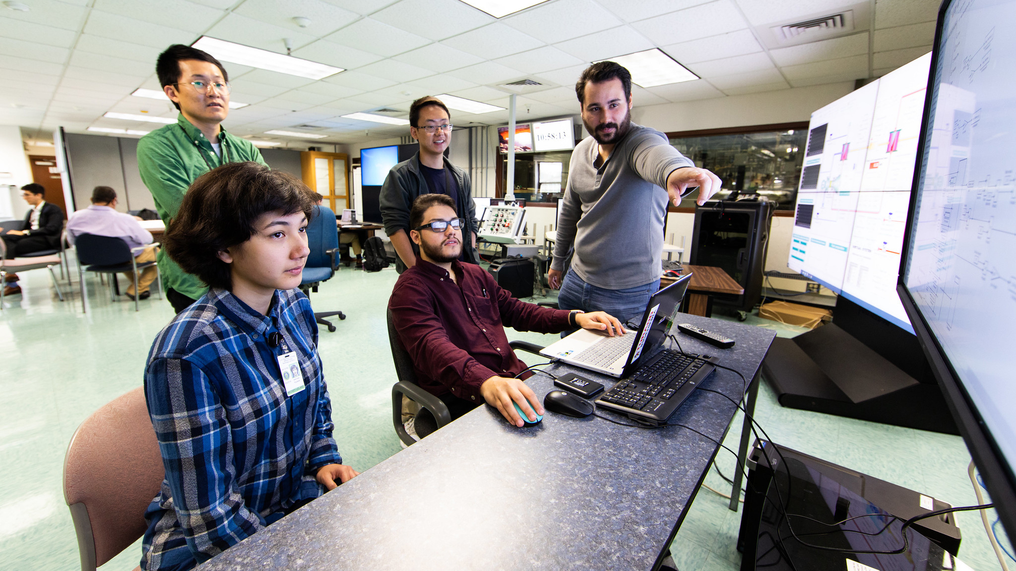 Research associates collaborate in NETL’s Hybrid Performance Facility Lab, 2019. 