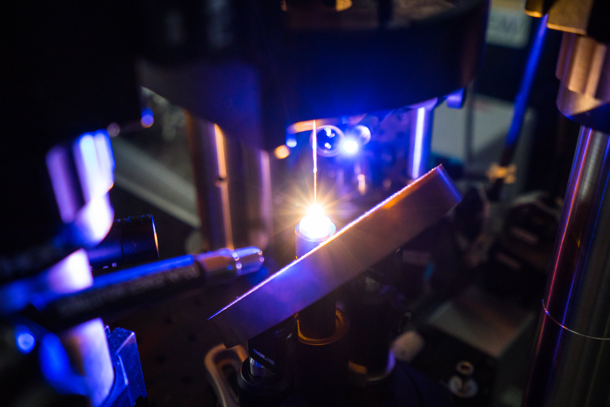 Show here is the focus of a 100-watt CO2 laser. At that focal point, a rod of alumina is being melted and transformed into a pure sapphire optical fiber. 