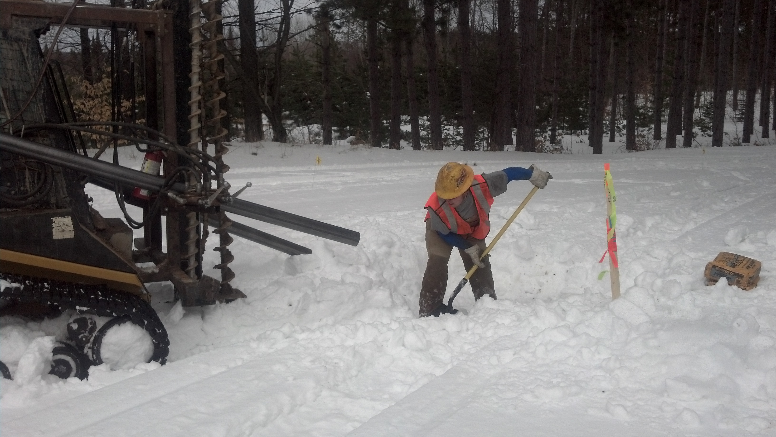 Drilling for installation of monitoring equipment during winter.
