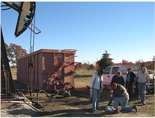 The University of Oklahoma and Arrow Oil and Gas team members are analyzing samples prior to the injection of a mixture of biosurfactant-producing bacteria into two wells that produce from the Viola formation located near Oil Center, OK.