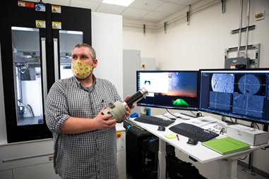 Dustin Crandall, Ph.D., demonstrates components of a recently upgraded computer tomography capability at NETL.