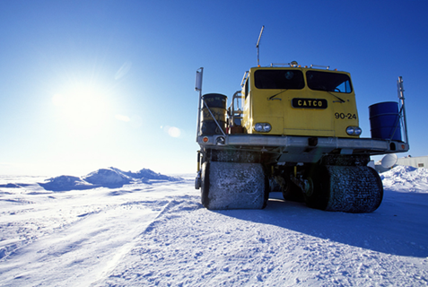 Rolligons, all-terrain vehicles that move on large, low-pressure adjustable tires, are typical of the vehicles used for transport on the North Slope, AK.