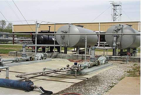 Three-phase separator, oil and water tanks, and oil and water pumps.
