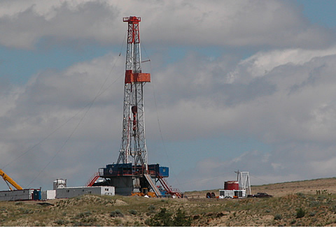 View of a large rig drilling an injection well for CBNG produced-water disposal in the Powder River Basin between Buffalo and Gillette, WY. Proposed drilling depth is 14,000 feet.