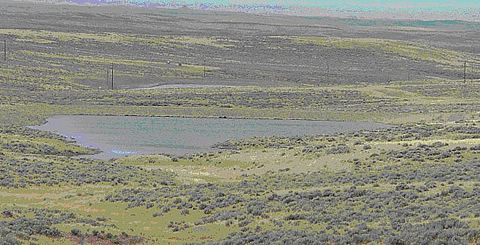 CBNG impoundment from the PRB in Wyoming located on-channel by means of a simple dam on the downgradient end of a small draw.