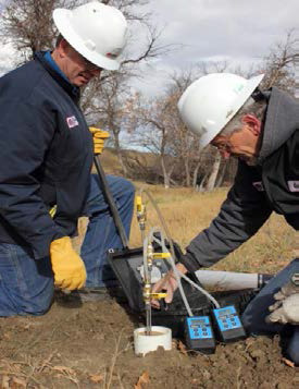 Researchers conducting soil gas monitoring as part of a CO2 storage project.