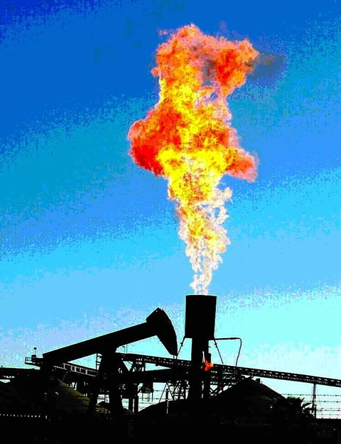 Associated gas being flared in a California oilfield.