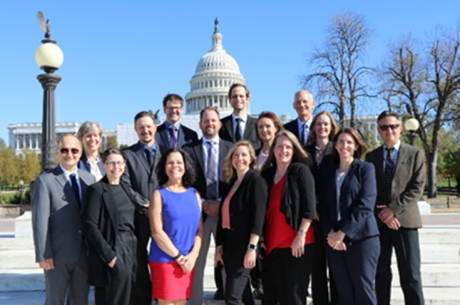 A group photo of all of the project experts standing in front of Capitol Hill