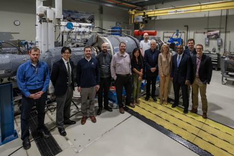 NETL’s Patcharin Burke and Richard Dalton, federal project managers on the Hydrogen with Carbon Management team, visited the START Lab facility along with Rich Dennis, the Lab’s Advanced Turbines technology manager, in 2022. (NETL staff, center-right) Photo Credit: Kelby Hochreither