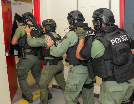 Members of the Morgantown, West Virginia, Police Department Special Response Team prepare to enter an interior door during a full-scale emergency exercise held at NETL-Morgantown.