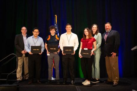 NETL’s David Lyons, Alexandra Hakala, Robie Lewis present awards for best student presentations and posters at the 2024 FECM/NETL Spring R&D Project Review Meeting.