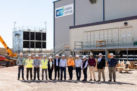 The membrane-based carbon capture testing facility will capture up to 150 tonnes of CO₂ per day from Basin Electric’s Dry Fork Station (DFS) coal fired power plant. Visitors from the Department of Energy Office of Fossil Energy and Carbon Management and the National Energy and Technology Laboratory are pictured with MTR personnel in front of the carbon capture testing facility on September 25th, 2024.