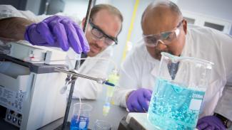 National Energy Technology Laboratory researchers Mac Gray and Chris Wilfong utilize sorbents to extract solubilized rare earth elements from aqueous solutions.