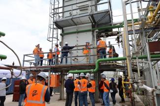 Industry professionals gathered around the demonstration furnace to see the ClearSign Core™ 2 operating live in a real-world setting. Image provided by ClearSign Technologies Corporation